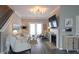 Bright living room with a fireplace, hardwood floors, white trim, and access to a back patio at 3811 Holliwell Pass, Cumming, GA 30040