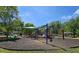 Community playground with slides, swings, and shaded seating for residents to enjoy outdoor activities at 3811 Holliwell Pass, Cumming, GA 30040