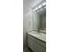 The bathroom has a granite countertop and a modern light fixture at 4081 Liberty Hill Dr, Norcross, GA 30093