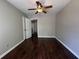 Open bedroom with hardwood floors, ceiling fan, neutral color walls and white trim at 4081 Liberty Hill Dr, Norcross, GA 30093
