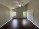 Vaulted primary bedroom with hardwood floors, neutral walls, two windows, and a ceiling fan, ready for personalization at 4081 Liberty Hill Dr, Norcross, GA 30093