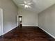 Bright primary bedroom with hardwood floors, neutral walls, two windows, vaulted ceiling, and a ceiling fan at 4081 Liberty Hill Dr, Norcross, GA 30093