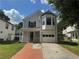 Charming two-story home with a brick walkway and one-car garage is nestled in a quiet neighborhood, offering curb appeal at 4081 Liberty Hill Dr, Norcross, GA 30093