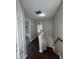 Hallway featuring wood floors and leading to rooms with natural light at 4081 Liberty Hill Dr, Norcross, GA 30093