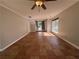 Spacious living room featuring tile flooring, a ceiling fan, and natural light from a large window at 4081 Liberty Hill Dr, Norcross, GA 30093