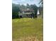 Spacious backyard with a play set, offering plenty of room for outdoor activities and Gathering fun at 955 Tributary Way, Dacula, GA 30019