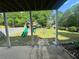 Backyard with a playground, providing a fun and safe space for children to play outdoors at 955 Tributary Way, Dacula, GA 30019