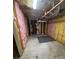 Unfinished basement showing exposed beams, insulation, and mechanicals awaiting customization at 955 Tributary Way, Dacula, GA 30019