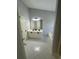 Bright bathroom with a double sink vanity, white cabinets, a large mirror, and a tub at 955 Tributary Way, Dacula, GA 30019