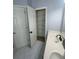 Bathroom features a double sink vanity and a walk-in closet with ample storage space at 955 Tributary Way, Dacula, GA 30019