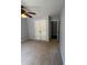 Bedroom featuring a ceiling fan, closet and neutral color palette at 955 Tributary Way, Dacula, GA 30019