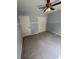 Bedroom with neutral walls, carpet, and double door closet at 955 Tributary Way, Dacula, GA 30019