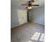 Bedroom featuring a ceiling fan, closet and neutral color palette at 955 Tributary Way, Dacula, GA 30019