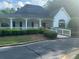 Charming clubhouse featuring white trim, covered porch, and well-maintained landscaping at 955 Tributary Way, Dacula, GA 30019