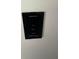 Fireplace control panel features buttons for on/off, heat control and flame dimmer at 955 Tributary Way, Dacula, GA 30019