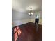 Bright dining room featuring hardwood floors and a modern chandelier at 955 Tributary Way, Dacula, GA 30019