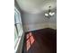 Dining room with hardwood floors, a chandelier, and a view to the outside at 955 Tributary Way, Dacula, GA 30019