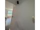 Hallway with window letting in natural light and hardwood flooring at 955 Tributary Way, Dacula, GA 30019
