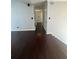 Hallway boasts gleaming wood floors and neutral paint at 955 Tributary Way, Dacula, GA 30019