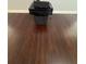 Close-up of hardwood floor with speaker and receiver atop a subwoofer at 955 Tributary Way, Dacula, GA 30019
