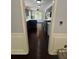 Modern kitchen with custom blue cabinets and hardwood floors at 955 Tributary Way, Dacula, GA 30019