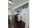 Updated kitchen with blue cabinets, stainless appliances, and hardwood flooring at 955 Tributary Way, Dacula, GA 30019