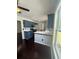 Bright kitchen has a breakfast bar, stainless appliances and hardwood flooring at 955 Tributary Way, Dacula, GA 30019