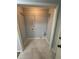 A quaint laundry area features practical tile flooring and convenient wire shelving, perfect for efficient organization at 955 Tributary Way, Dacula, GA 30019