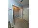 Laundry room with white door and wire shelving at 955 Tributary Way, Dacula, GA 30019