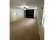 Spacious living room with carpet, fireplace, and lots of natural light at 955 Tributary Way, Dacula, GA 30019