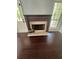 Spacious living room featuring a fireplace and dark hardwood floors at 955 Tributary Way, Dacula, GA 30019