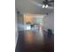 Open-concept living room with vaulted ceilings and dark hardwood floors at 955 Tributary Way, Dacula, GA 30019