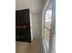 Living room showing electric fireplace, accent wall, and large window with natural light at 955 Tributary Way, Dacula, GA 30019