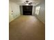 Bright living room with a ceiling fan and modern electric fireplace feature wall at 955 Tributary Way, Dacula, GA 30019