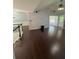 Spacious living room featuring hardwood flooring, a vaulted ceiling, and ample natural light at 955 Tributary Way, Dacula, GA 30019
