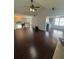 Open-concept living space with hardwood floors, vaulted ceilings, and natural light at 955 Tributary Way, Dacula, GA 30019