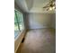 Main bedroom features tray ceilings and a large window at 955 Tributary Way, Dacula, GA 30019