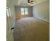 Spacious main bedroom has tray ceilings and natural light at 955 Tributary Way, Dacula, GA 30019