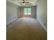 Spacious main bedroom features tray ceilings at 955 Tributary Way, Dacula, GA 30019