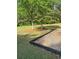 Park with mature tree, woodchips, a bench, and luscious green grass at 955 Tributary Way, Dacula, GA 30019