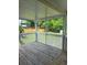 Screened porch with wood floors and a view of the yard at 955 Tributary Way, Dacula, GA 30019