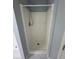 Bathroom shower unit with chrome shower head and tile floor at 955 Tributary Way, Dacula, GA 30019