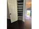 Pantry with built-in shelving next to front entry at 955 Tributary Way, Dacula, GA 30019