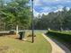 Well-maintained tennis courts with green space and picnic tables for a relaxed setting at 955 Tributary Way, Dacula, GA 30019