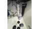 Under-sink plumbing and filtration system with soap bottle at 955 Tributary Way, Dacula, GA 30019