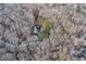 Aerial view of the house surrounded by trees and a winding driveway at 4220 Chapel Hill Farms Dr, Douglasville, GA 30135