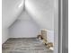 Attic with sloped ceilings, vinyl flooring, and an overhead light fixture at 4220 Chapel Hill Farms Dr, Douglasville, GA 30135
