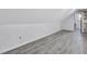 Unfinished attic space with sloped ceilings and vinyl flooring, ready for customization at 4220 Chapel Hill Farms Dr, Douglasville, GA 30135