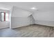 Large attic room with a window to let in natural light at 4220 Chapel Hill Farms Dr, Douglasville, GA 30135
