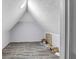 Unfinished attic room with gray flooring and white walls at 4220 Chapel Hill Farms Dr, Douglasville, GA 30135